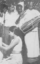 Gamini Kariyawasam recording a field visit of the then Minister of Broadcasting, Hon. C. B. Wijetunga, with a portable recording machine.